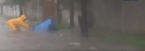 Outrage as video surfaces of Ghanaian dumping trash on flooded street amid heavy rain