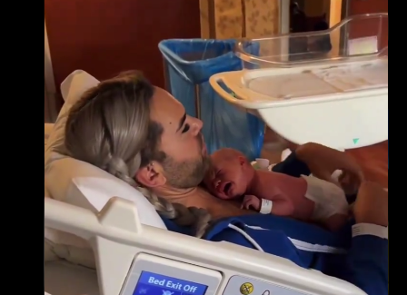 (Video) Netizens react as transgender man receives newborn baby in hospital bed