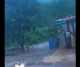 Watch as woman and baby are saved from floodwaters