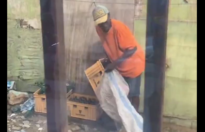 Scrap collector caught on camera stealing crates of bottles from residence