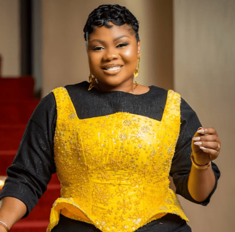 Empress Gifty pays a visit to her mother's grave to sprinkle oil and powder